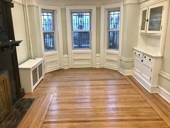 Iiving space with fireplace and built in cabinets - 1061 Clay Ave