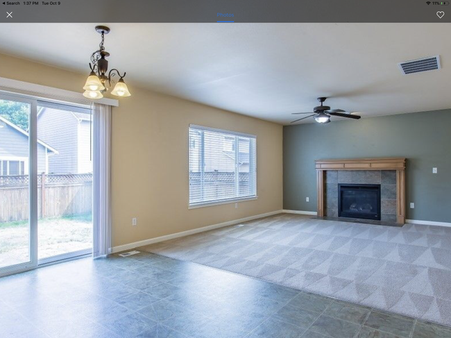 Family room off kitchen with fireplace - 6926 Prism St SE
