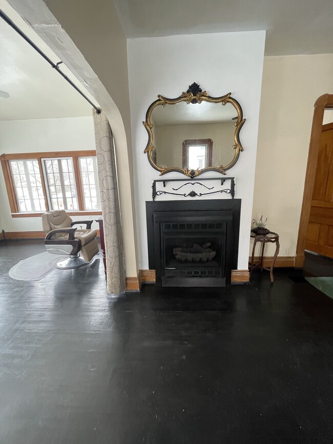 Beautiful Gas fireplace warms the soul of this beautiful, historic old home. - 438 S Main St