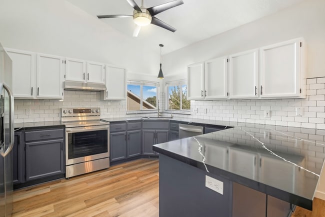 Building Photo - Modern 5 Bedroom Home with 3Car Garage in ...