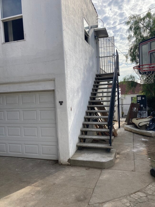 Stairs leading to unit. - 1526 E Wilson Ave