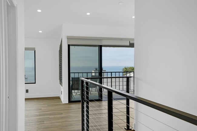 Building Photo - Coastal Bliss Awaits: Luxurious 3-Bed, 3.5...