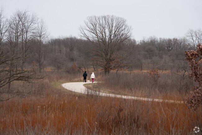 Residents enjoy walking in Greenbelt Forest Preserve near Park City.