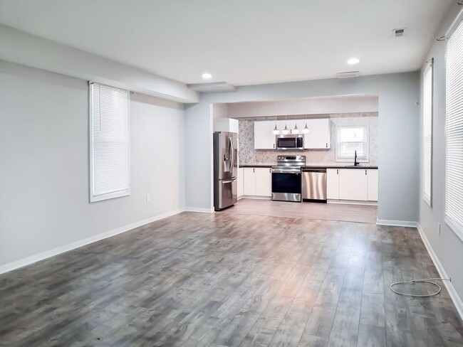 Building Photo - Upgraded 4BR/2.5BA SFH with 1st fl BR. Nea...