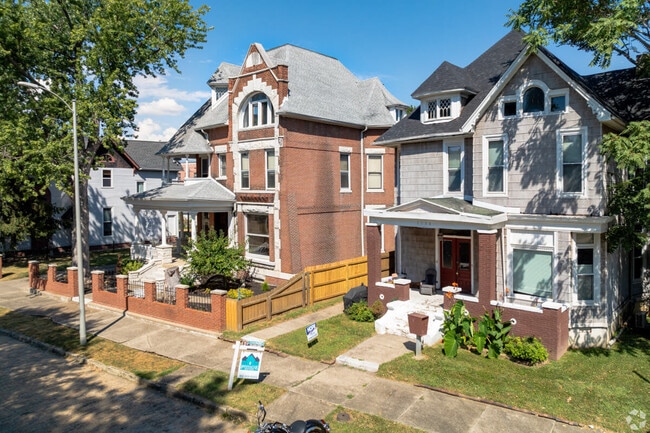 Historic Evansville homes often feature detached garages and small lawns with paved entryways.