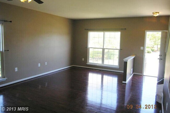 Spacious living room with gleaming hardwood! - 124 Whitman Lane