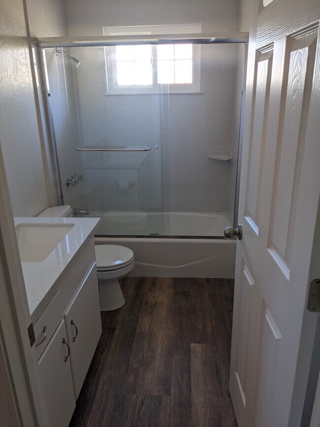 Newly Remodeled bathrooms with quartz counters and tub surround - 4796 Heyer Ave