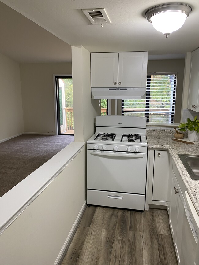 Kitchen area with opening to living room. - 1825 Bridgetown Pike