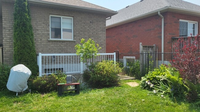 Back view (wood privacy fence installed after this photo) - 63 Georgian Meadows Dr