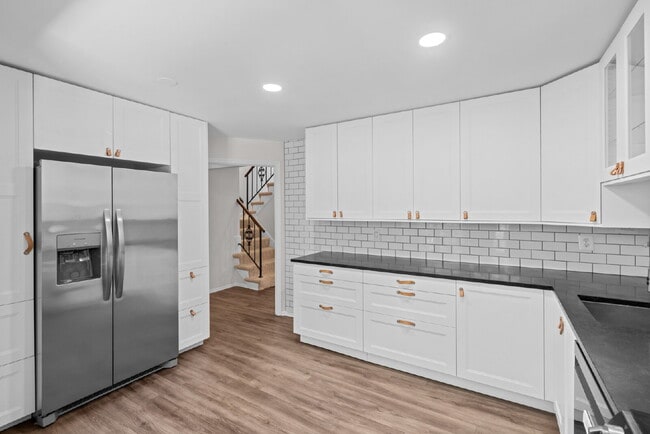 Photo - Completely Renovated Corner Townhome with Modern Kitchen, Designer Baths, and Private Yard