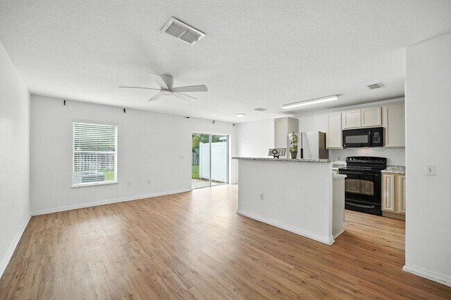 Building Photo - 32218 Gem: Open-Concept Townhome Minutes from the Airport