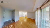 Located at 2723 Campus Walk Ave in Durham, NC, this single-floor unit offers a practical and well-organized layout across four bedrooms and a combined kitchen and living area. The open living room features warm hardwood flooring that extends throughout most of the unit, neutral-toned walls, and a textured ceiling. A sliding glass door floods the living space with natural light and provides direct access to an outdoor area with pleasant greenery views. The kitchen is efficiently designed with white cabinetry, granite-style countertops, a stainless steel double sink, and white appliances including an electric range, offering a clean and functional workspace. Each of the four bedrooms continues the hardwood flooring theme and is finished with neutral walls and textured ceilings. The primary bedroom is a generously sized room, while the remaining bedrooms each offer comfortable proportions. Several bedrooms feature windows overlooking lush outdoor greenery, adding a sense of calm and natural light. Some bedrooms include closets with paneled double doors for added storage. A dedicated laundry area houses a full-size washer and dryer, adding everyday convenience to this well-appointed unit.
