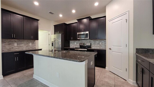 Foto del edificio - 9881 Magnolia Woods Blvd