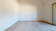 This 680 square foot apartment in Fullerton, CA offers a practical living space with two bedrooms and one bathroom. The single-story layout maximizes efficiency, with the primary bedroom measuring 140 square feet. The modern kitchen is a standout feature, boasting rich wood cabinetry, stainless steel appliances, and a convenient breakfast bar with granite countertops. The living area seamlessly connects to the outdoors through a sliding glass door, allowing natural light to flood the space. Neutral-toned walls and plush carpeting throughout create a cohesive, contemporary feel. The bathroom, while compact, includes a shower/tub combination and a granite-topped vanity. Built-in closets in the bedrooms provide ample storage. The apartment's design emphasizes functionality and comfort, making it an ideal choice for those seeking a well-appointed living space in a prime Fullerton location.