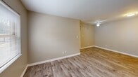 Located at 2627 Wimpole Ave in Knoxville, Tennessee, this single-floor, 2-bedroom, 1-bathroom home offers a practical and well-organized layout. Wood-look laminate flooring runs throughout every room, providing a cohesive and easy-to-maintain finish that ties the space together.

The living room is an open, well-lit area featuring a ceiling fan and neutral warm-toned walls, creating a welcoming atmosphere. It flows naturally into the rest of the home, making the layout feel connected and functional.

The kitchen is equipped with warm wood cabinetry, a double-basin sink, a black electric range, and a full-size white refrigerator. A window above the sink brings in natural light, and the layout efficiently maximizes the available space for cooking and food preparation.

Both bedrooms feature the same wood-look flooring and neutral wall tones. Each room includes a built-in closet with bi-fold doors, offering practical storage. The primary bedroom provides a comfortable footprint, while the second bedroom is equally well-appointed. Both rooms receive light from ceiling fixtures.

The bathroom includes a full tub and shower combination with white surround panels and chrome fixtures, providing a clean and functional bathing space. Overall, the home presents a tidy, move-in ready environment suited for a variety of living arrangements.