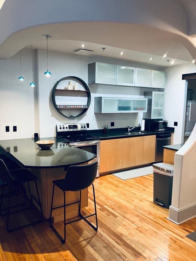 Building Photo - Turn-Key Downtown Asheville Condo | Historic Old Penney’s Building | Rooftop Views