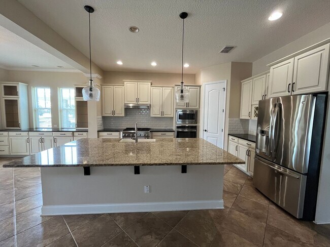 Building Photo - Amazing Lake Nona 4 bedroom house with Lau...