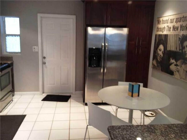 Building Photo - Newly Renovated 2/1 with Private Patio and...