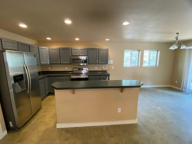 Building Photo - Perfectly Placed & Refreshed Spanaway Home...