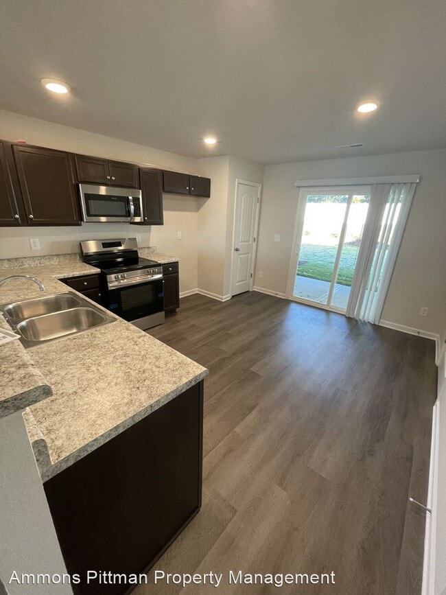 Building Photo - 2 br, 2.5 bath House - 1024 Peony Lane