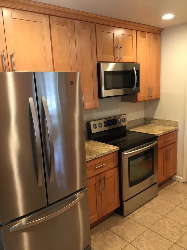 Kitchen with new appliances, upgraded cabinet and granite counters - 2394 Pauline Drive