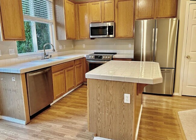 Building Photo - The Townhome That Ticks Every Box: Space, Privacy, and Location!