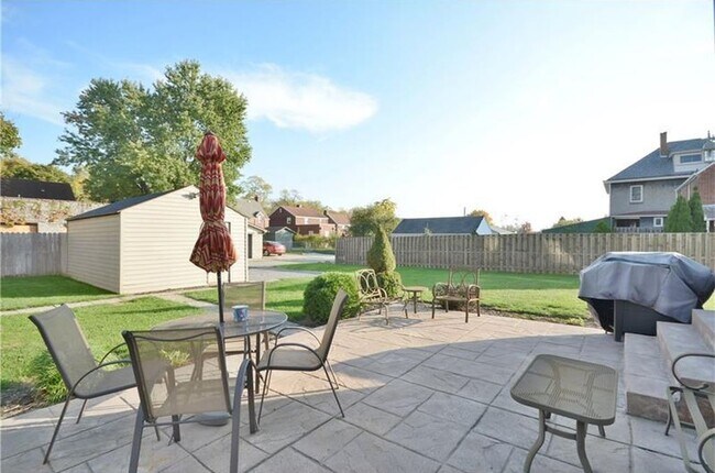 Large Back Patio with stamped concrete perfect for grilling and entertaining - 110 Patterson Ave