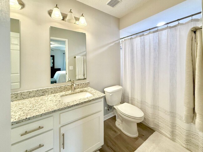 Building Photo - Charming Neptune Beach Townhome – Your Coa...