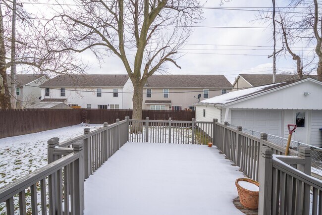 Fenced in yard and nice sized deck. - 1003 McGregor St
