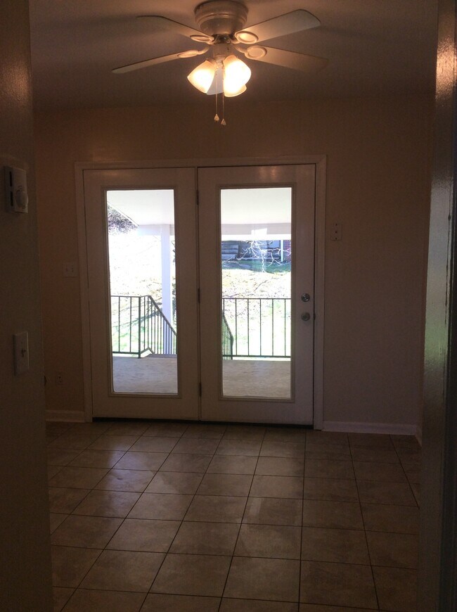 Kitchen French doors open to covered porch - 601 West Poplar