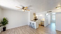 Located at 6320 N 16th St in Phoenix, AZ, this single-story, one-bedroom, one-bathroom unit offers a thoughtfully designed layout that maximizes its cozy footprint. Light wood-look flooring runs throughout the space, creating a cohesive and modern aesthetic.

The kitchen is a standout feature, equipped with stainless steel appliances including a gas range, dishwasher, and refrigerator. White cabinetry lines the walls with a classic subway tile backsplash, while a peninsula with a white countertop and bar seating provides a convenient dining and prep area. A ceiling fan overhead adds comfort to the adjacent living area, which benefits from natural light and clean white walls.

The bedroom is a comfortable, well-proportioned retreat featuring a ceiling fan with a light fixture, a window for natural light, and a sliding-door closet offering ample storage. The textured ceiling adds subtle character throughout.

The bathroom is clean and functional, showcasing large-format tile surrounds in a neutral tone within a tub-shower combination. Wood-look flooring continues here, complementing the white vanity and fixtures for a streamlined, unified look.

Overall, this unit presents a clean, modern interior with consistent finishes, making it a practical and attractive living space in central Phoenix.
