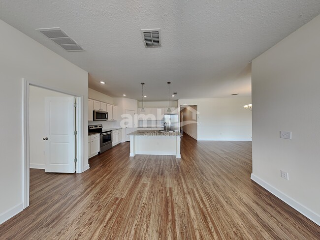 Building Photo - 6614 Hidden Rose Place