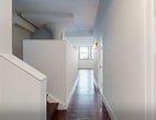 This 770 square foot apartment, located at 3131 Walnut St in Philadelphia, offers a blend of historic charm and modern convenience. The single-floor layout maximizes space efficiency, featuring high ceilings that create an airy atmosphere. Large windows with blue trim flood the rooms with natural light and offer city views.

The heart of the home is a sleek, updated kitchen. White cabinetry contrasts beautifully with stainless steel appliances and granite countertops. A subway tile backsplash adds a touch of classic elegance. The kitchen opens to other living areas, promoting an open-concept feel.

Rich hardwood floors run throughout, providing warmth and continuity. The bathroom is pristine and functional, with white tiles and modern fixtures. A dedicated laundry area with a stacked washer and dryer unit offers convenience, while an adjacent closet provides ample storage.

The apartment's versatile layout allows for customizable living spaces. Exposed brick walls in some areas add character, blending seamlessly with the crisp white walls. This urban dwelling strikes a perfect balance between historic architectural elements and contemporary design, creating a stylish and comfortable living environment in the heart of Philadelphia.