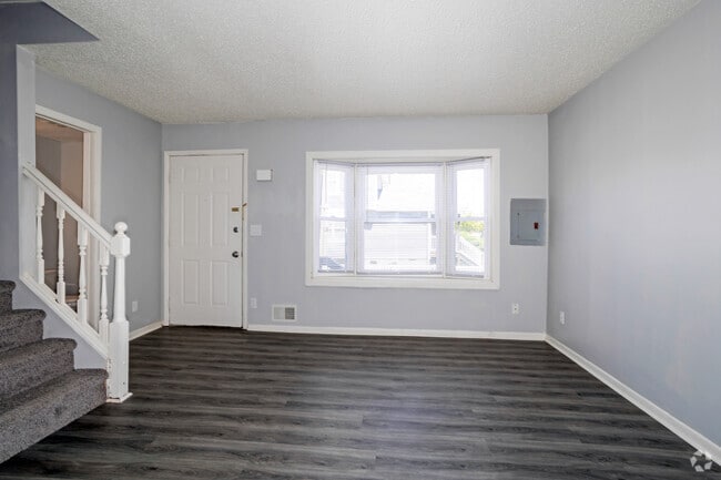 3BR, 1.5BA - 1,129SF - Living Room - Charles Drew Court Apartments