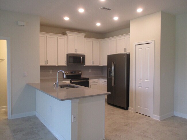 Building Photo - 4BD/2.5BA Townhome in Sawgrass Plantation!