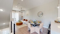 Located at 123 Merritt St in Fort Worth, TX, this contemporary 2-bedroom, 3-bathroom home spans three floors, offering a well-organized layout with dedicated spaces for living, dining, and relaxing. The main living floor features an open-concept design combining the living room, dining area, and kitchen. The kitchen is a standout, boasting two-tone cabinetry with white upper cabinets and wood-finish lower cabinets, quartz countertops, a tile mosaic backsplash, stainless steel appliances, a range hood, and a large island with bar seating. The living and dining areas share light wood-look flooring and are complemented by recessed lighting and a ceiling fan. Six balconies throughout the home provide abundant access to outdoor space and natural light. The bathrooms are finished with modern floating vanities, LED-lit mirrors, and marble-look tile flooring. Bedrooms feature wood-look flooring, generous windows with garden views, and dedicated closets with built-in shelving. Staircases are finished with wood-look treads and sleek black metal railings. A laundry room and pantry add further functionality. The home's neutral palette, modern fixtures, and clean lines create a cohesive, contemporary aesthetic throughout.