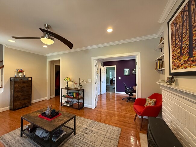 Living room, ceiling fan and built-in shelving - 5715 7th St N