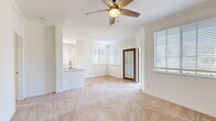 Located in San Diego, CA (92108), this 2-bedroom, 1-bathroom residence offers a well-designed single-floor layout with a bright and airy feel throughout. The open living area is filled with natural light from multiple windows adorned with white blinds, and features warm neutral carpet and a ceiling fan overhead. A glass-paneled entry door adds a welcoming touch to the space.

The kitchen is appointed with light wood cabinetry, striking marble-look quartz countertops, stainless steel appliances including a dishwasher and refrigerator, and light hardwood-style flooring. A breakfast bar connects the kitchen to the living area, enhancing the open-concept flow.

Both bedrooms are carpeted and include ceiling fans, with the primary bedroom offering a walk-in closet equipped with wire shelving for ample storage. Each bedroom benefits from natural light through sizable windows. The bathroom features a full tub/shower combo with white tile surround, a quartz-topped vanity with light wood cabinetry, and hardwood-style flooring. A dedicated in-unit laundry room with washer and dryer hookups adds everyday convenience. Two hallways and two closets complete this functional and well-appointed San Diego residence.
