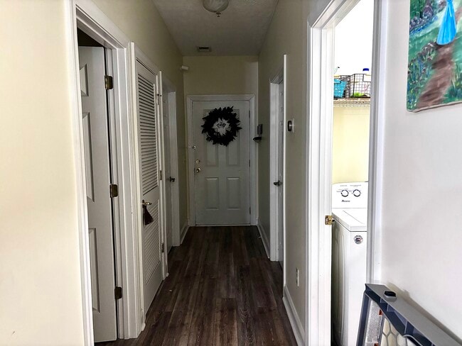Entryway with 2 bedrooms, shared bathroom, and in unit laundry room - 111 Fountain Pointe Ln