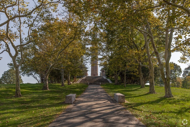 Walk up the canopy of trees to the WW2 Obelisk Memorial.