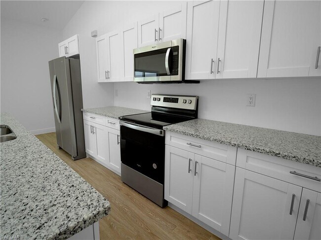 granite and stainless steel appliances - 1035 Plantation Rd
