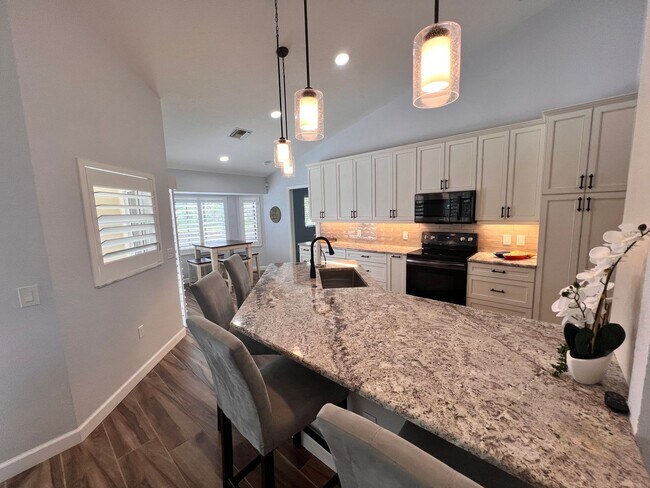 Building Photo - Waterfront Paradise in Punta Gorda Isles –...
