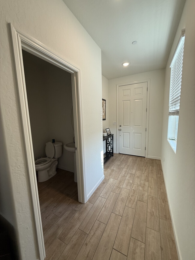 Entry/downstairs bath - 6390 E Meritage Dr