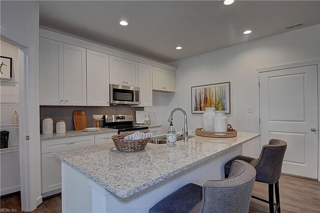 Building Photo - Three Bedroom Available