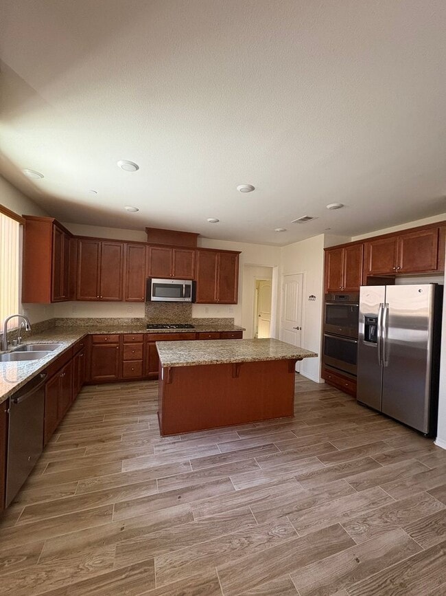 Building Photo - Spacious 4-Bedroom Home with Large Backyard.