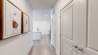 Located in Colorado Springs, CO, this well-appointed 2-bedroom, 2-bathroom residence offers a thoughtfully designed single-floor layout with modern finishes throughout. Light-toned luxury vinyl plank flooring runs throughout the home, creating a cohesive and clean aesthetic.

The open-concept kitchen and living area serves as the heart of the home. The kitchen features light wood cabinetry, a white quartz countertop island with bar seating, a subway tile backsplash, and a full suite of stainless steel appliances. The adjoining living room is bright and welcoming, with recessed lighting, a ceiling fan, and windows that allow ample natural light and outdoor views.

A hallway connects the bedrooms, each with its own dedicated closet. The primary bedroom is a comfortable retreat with clean white walls and direct sightlines to the kitchen. The two bathrooms are distinctly appointed: one features a sleek walk-in shower with black-framed glass doors and a wide vanity with light wood cabinetry, while the second includes a full soaking tub with a shower combo and matte black fixtures. Both bathrooms maintain a crisp, modern aesthetic with wood-look flooring and clean white surrounds. The overall ambiance is contemporary, functional, and move-in ready.
