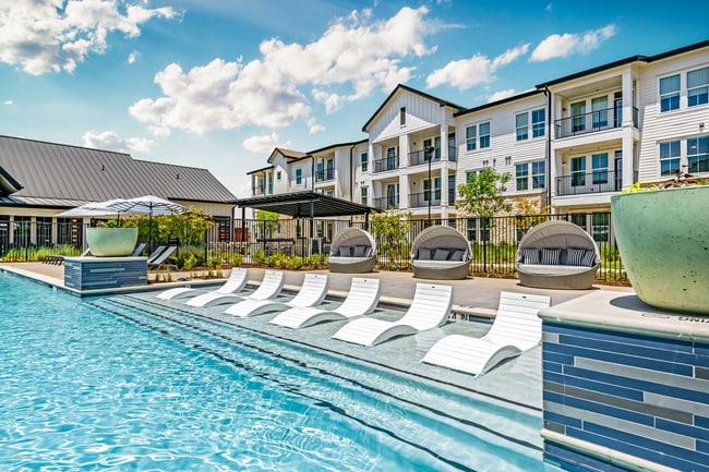 Resort-Style Pool with Expansive Sun Deck and Game Lawn - Atlas Bluewood Apartments