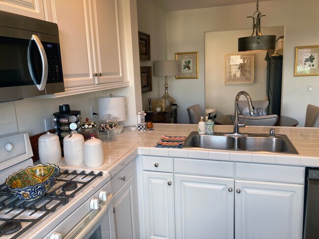 Kitchen towards dining area and office nook. - 6020 Seabluff Dr