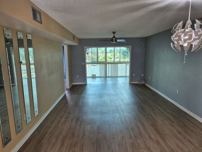 Building Photo - Waterfront Community Living | Updated 2BR/2BA Condo with Private Beach Access