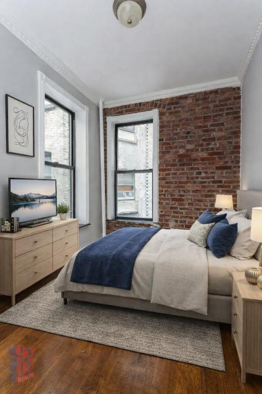 Photo - 309 E 8th St Apartment